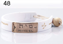 Carica l&#39;immagine nel visualizzatore di Gallery, 48) MIYHE’EL - 18 a 22 Novembre, bracciale caucciù piastrina bronzo

